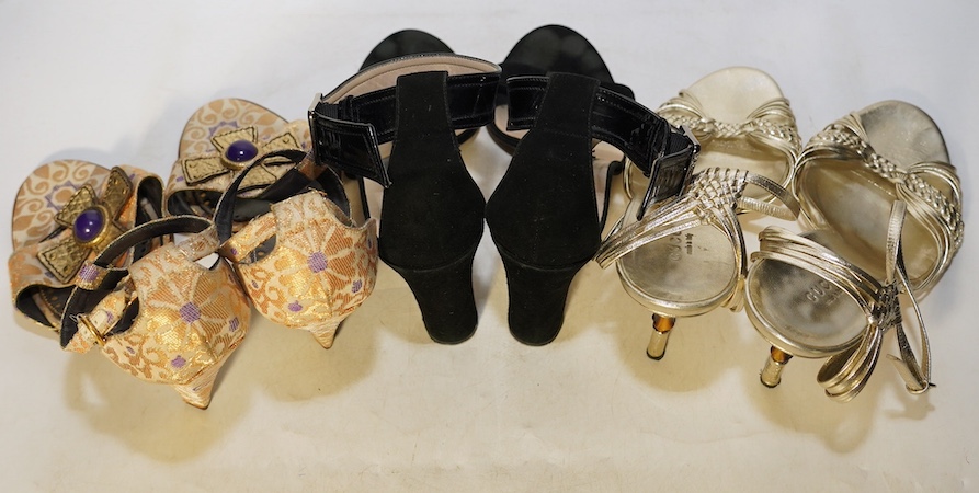 A pair of gold and bamboo Gucci sandals, a pair of Gucci black suede and patient leather sandals and a pair of Yves Saint Laurent gold canvas sandals, sizes 40.5 (Gucci) 40 (YSL)